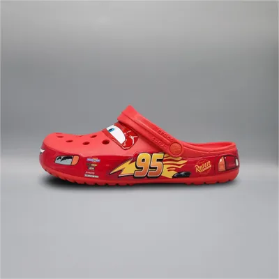 A single red Crocs Classic Clog featuring a Cars Lightning McQueen design is shown against a plain gray background.
