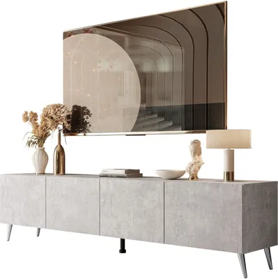 A TV stand with a television mounted above it, along with decorative items.