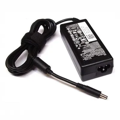 A black Dell AC adapter with its cord neatly wrapped and secured with a velcro strap, placed on a white background.