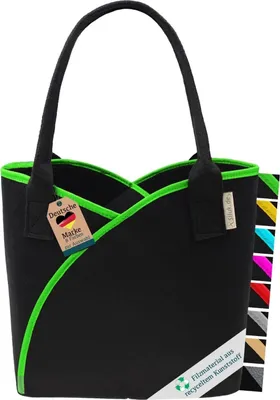 A black felt tote bag with green trim, shown against a white background. Several smaller swatches of colored felt are visible on the right side of the image.