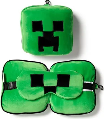 A green Minecraft Creeper travel pillow and eye mask set.