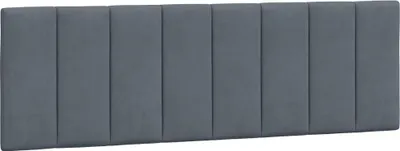 A headboard cushion with vertical channels.