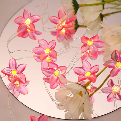 LED Blumen-Lichterkette, 30 Lilien, warmweiß, batteriebetrieben, rosa