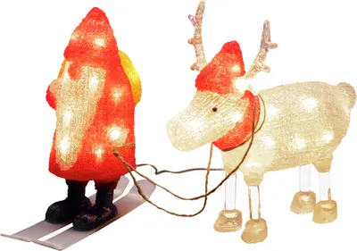A Christmas decoration featuring a Santa Claus figure on skis being pulled by a reindeer.