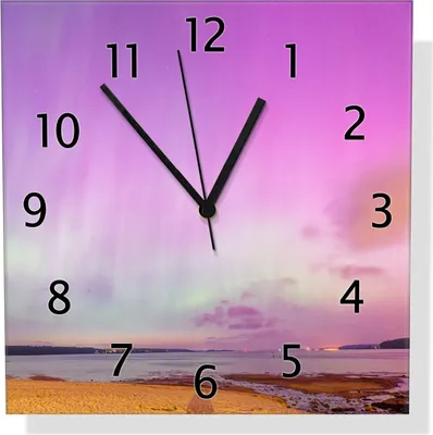 Produktbild von Wallario Design Wanduhr Leuchtende Lichter über Sandstrand aus Echtglas, Größe 30 x 30 cm