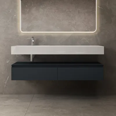 A modern bathroom vanity with a white sink and anthracite drawers against a gray marble wall.