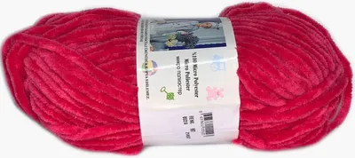 A ball of red yarn with a label wrapped around it.