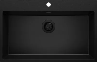 A top-down view of a black granite kitchen sink with a single basin and a drain assembly.