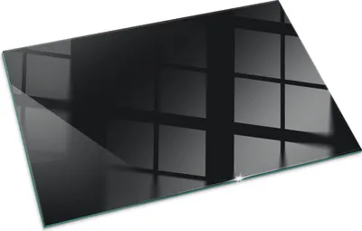 A black glass hearth plate with reflections of a grid pattern.
