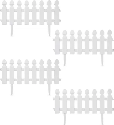 Four white picket fence sections arranged in a grid.