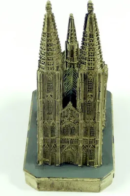 A miniature model of a cathedral on a gray base.