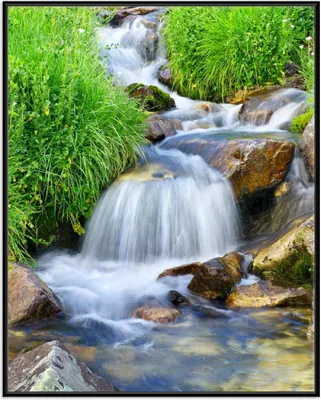 Produktbild von Wallario Wandbild Kleiner Bach über Steine, Größe: 40,30 x 50,30 cm, Poster mit schwarzem Aluminiumrahmen