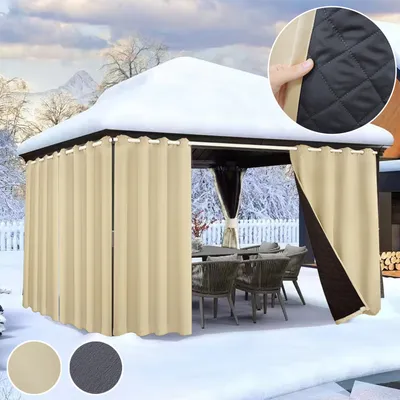 A gazebo covered in snow with beige curtains drawn around it, showing outdoor furniture inside.