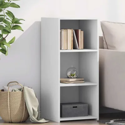 A white, three-shelf storage unit is shown in a room with a plant and a basket.