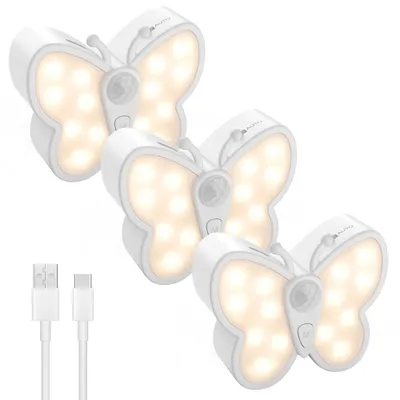 Three butterfly-shaped LED night lights and two USB charging cables are displayed against a white background.