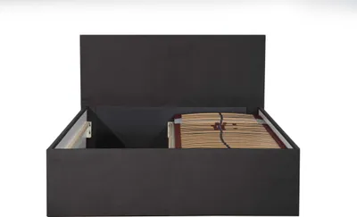 A dark gray upholstered bed frame with the mattress and slatted base visible inside the storage compartment.