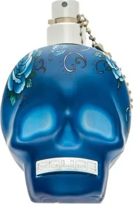 A blue skull-shaped perfume bottle with floral designs and the brand name 'POLICE' on the front.