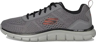 A side view of a single athletic shoe.