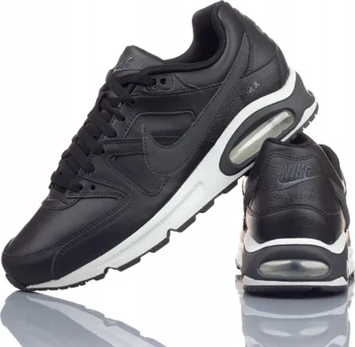 A pair of black Nike Air Max Command leather sneakers are displayed against a white background.