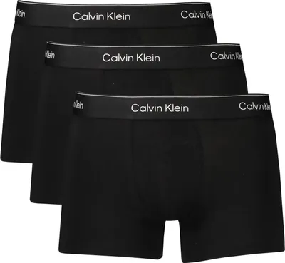 Three black Calvin Klein boxer shorts are stacked on top of each other.
