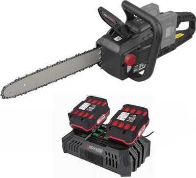 A cordless chainsaw with two batteries and a charger, presented against a white background.