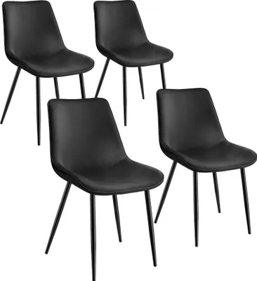 Four black chairs are arranged in a studio setting against a white background.