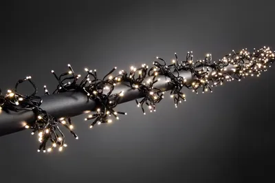 Produktbild von Konstsmide - Micro LED Büschelllichterkette "Cluster", mit 8 Funktionen, Steuergerät und Memoryfunktion, 760 warm weiße Dioden, 24V Außentrafo, schwarzes Kabel ; 3792-100