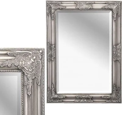 A silver baroque-style mirror is shown against a white background. A portion of a second, smaller mirror is visible on the left side of the image.
