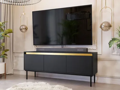 A modern living room with a TV stand and television.