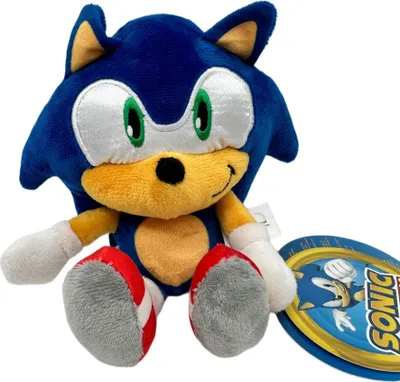 A plush toy of Sonic the Hedgehog is shown sitting down, with a product tag next to it.