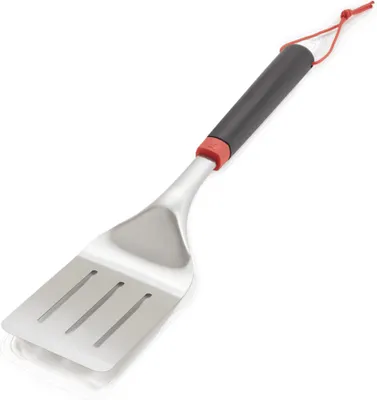 A stainless steel spatula with a black and red handle, shown against a white background.