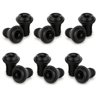 A set of black wine saver vacuum stoppers arranged in two rows on a white background.