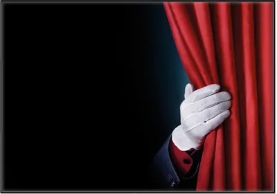 Produktbild von Wallario Wandbild Vorhang auf für die Show  Hand hinterm roten Vorhang, Größe: 70,30 x 100,30 cm, Poster mit schwarzem Aluminiumrahmen