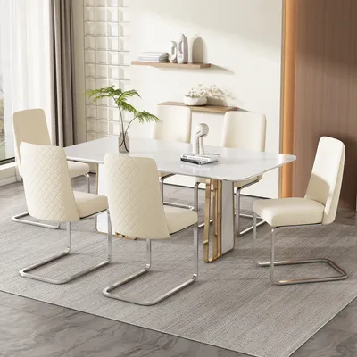 A dining room set with a marble-top table and six beige upholstered chairs with silver metal legs.