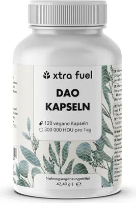 A white bottle of DAO Kapseln with a label showing product details and decorative plant illustrations.