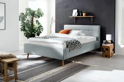 Produktbild von Meise Möbel Stauraumbett Lotte 140x200 cm | Bettkasten & Lattenrost | Webstoff Eisblau | Holzfuß eichefarbig