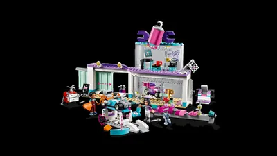 A LEGO Friends Tuning Workshop playset is displayed against a black background.