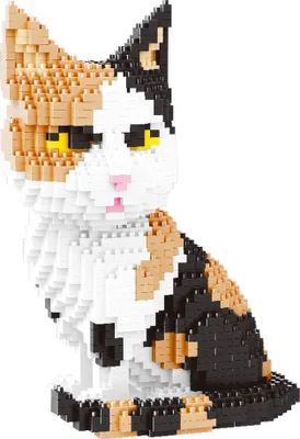A calico cat figurine made of small building blocks, sitting and looking to the side.