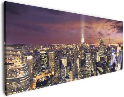 Produktbild von Wallario Premium Leinwandbild New York bei Nacht - Panoramablick über die Stadt in Größe 50 x 125 cm