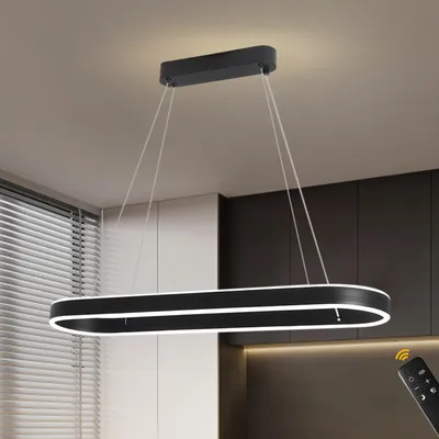 A modern black LED pendant light fixture hanging from the ceiling in a room with blinds and cabinetry.