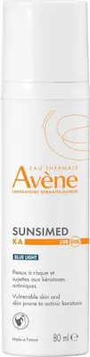 A product shot of a sunscreen bottle against a white background.