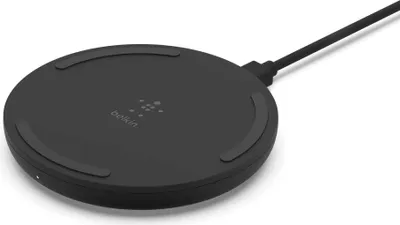 A black Belkin wireless charging pad is shown from a slightly elevated angle against a white background.