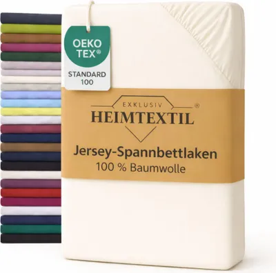 A stack of folded bedsheets in various colors is shown next to a cream-colored bedsheet with a product label.