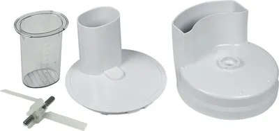 Several white plastic parts of a kitchen appliance are laid out on a white background.