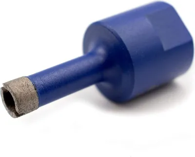 A close-up studio shot of a blue drill bit with a diamond tip.