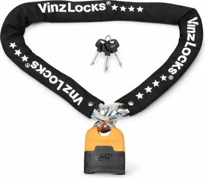 A black chain lock with an orange and black padlock and three keys, laid out on a white background.
