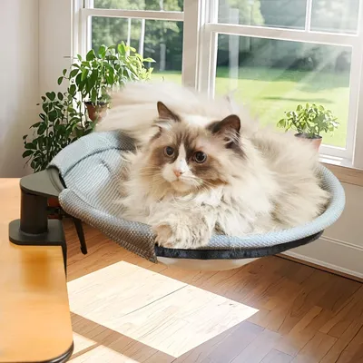Immagine prodotto di Cuccia rotonda e morbida per gatti, con sistema di fissaggio