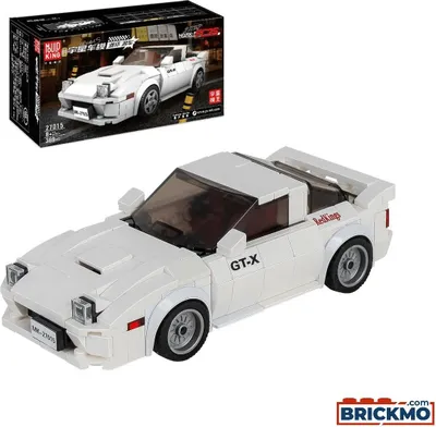 A white toy car model and its packaging.