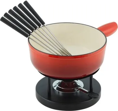 A red fondue pot with a set of fondue forks on a black stand, isolated on a white background.