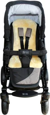 A close-up front view of a baby stroller seat with a sheepskin liner.